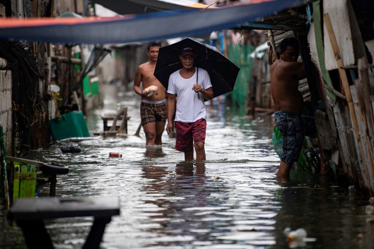 A contracorriente, filipinos luchan contra el aumento del nivel del mar en una isla en vías de desaparición A contracorriente, filipinos luchan contra el aumento del nivel del mar en una isla en vías de desaparición