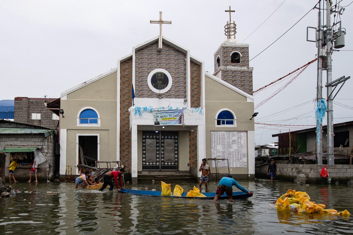 A contracorriente, filipinos luchan contra el aumento del nivel del mar en una isla en vías de desaparición A contracorriente, filipinos luchan contra el aumento del nivel del mar en una isla en vías de desaparición