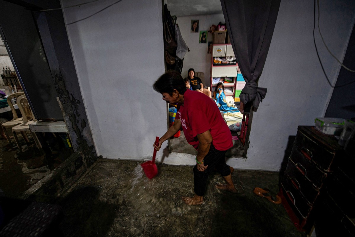 A contracorriente, filipinos luchan contra el aumento del nivel del mar en una isla en vías de desaparición A contracorriente, filipinos luchan contra el aumento del nivel del mar en una isla en vías de desaparición